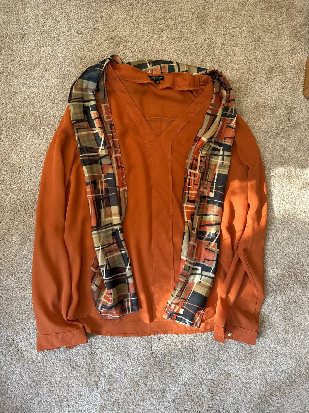 Rust Orange V-Neck Blouse with Geometric Scarf